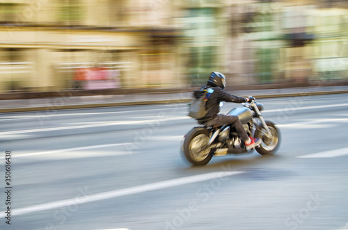 Fast motorcycle riding around the city.