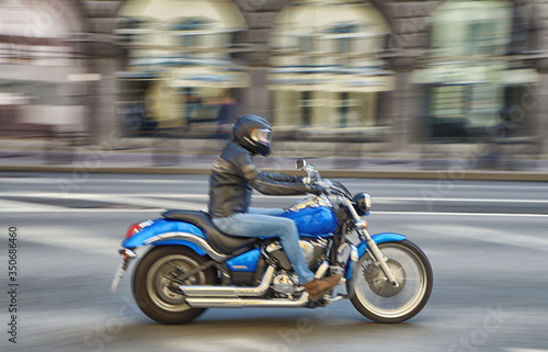 Fast motorcycle riding around the city.