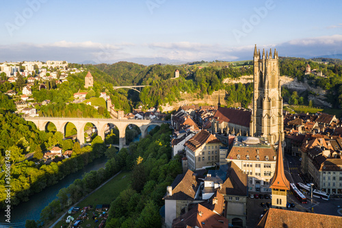 Fribourg old town with its famous Gothic Cathedral St Nicolas by the Sarine river in Switzerland on a nice late afternoon light
