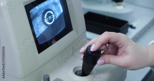 Doctor optometrist checks eyesight on a special monitor