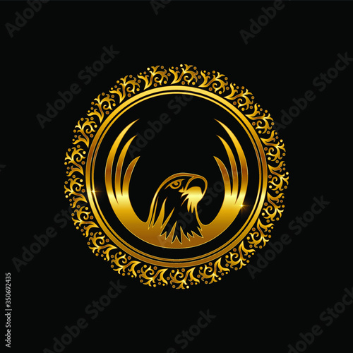 a golden eagle with circle frame ornament photo