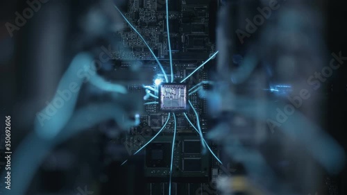 The main processor on the large board is connected to other circuits via wires glowing with blue light. Internal structure of microchip is glows in operating mode. Closeup. Dolly shot. Shallow depth o photo