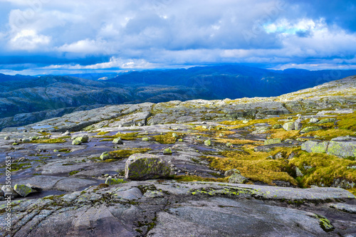 Trail to Kjeragbolten. Landscapes of the Norwegian mountains, where the famous boulder stuck at an altitude of 984 meters above Lysefjorden on Mount Kjerag, Norway