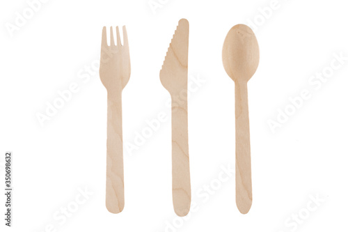 Eco-friendly natural spoon, knife, fork. Disposable ecological utensils on white background. Sustainability of planet. Closeup cutlery cardboard plate made of fiber of bamboo and bagasse.