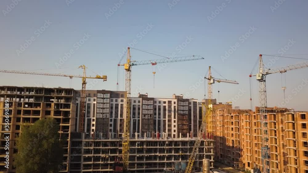 Aerial view of tall residential apartment buildings under construction. Aerial view of tall residential apartment buildings under construction.