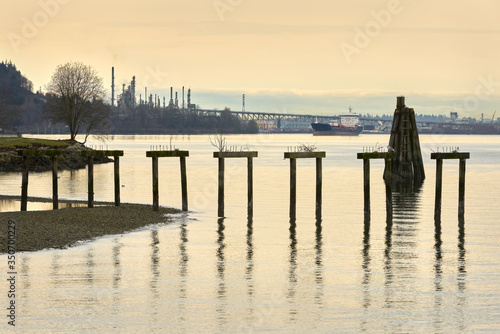 Burrard Inlet Tanker and Oil Refinery. Oil Refinery and Tanker in Burrard Inlet. Vancouver, British Columbia, Canada.   © maxdigi