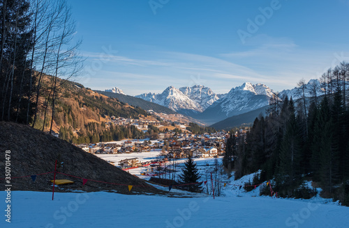 Winter landscape with a village Padola in the Dolomite mountains of the Alps, Comelico, Italy, January 2020 photo