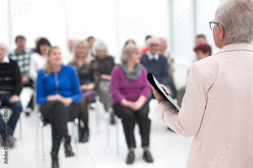 Businesswoman addressing colleagues at office meeting