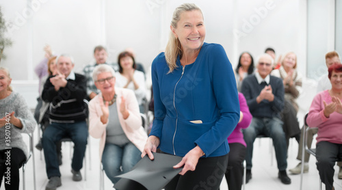 Businesswoman addressing colleagues at office meeting