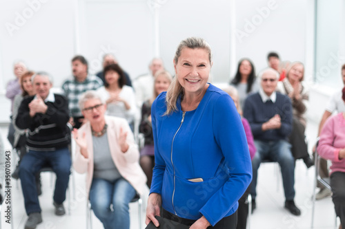 Businesswoman addressing colleagues at office meeting