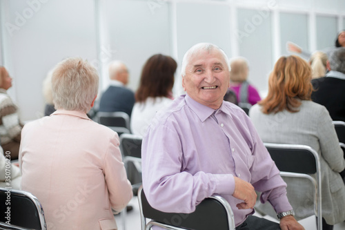 Mature man sitting in adult education class