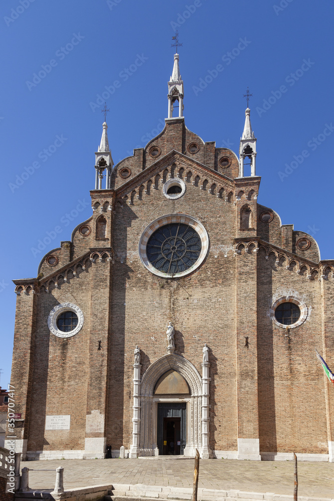 August 2016 - Venice, Italy - Basilica dei Frari - Facade - Many works of art are housed inside, including two paintings by Titian.