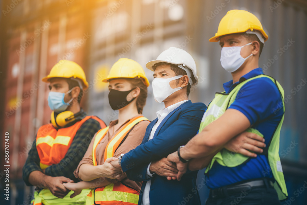 Handshake among businessmen, engineers, chief technicians and foreman, concept of cooperation in working on cantainer yard warehouses and international transportation. Handshake among businessmen, engineers, chief technicians and foreman, concept of cooperation in working on cantainer yard warehouses and international transportation.