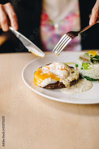 poached egg on steak with rice garnish