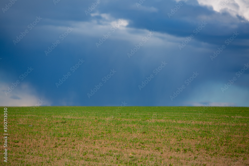 Dark clouds over field before a tunderstorm