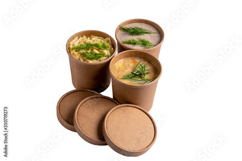 Mushroom, chicken and pea soups in paper disposable cups for take-out or delivery of food isolated on white background.