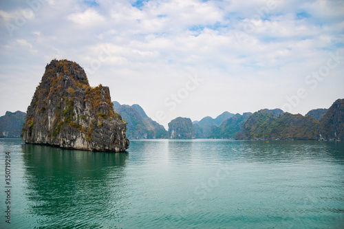 Halong Bay, Vietnam, with limestone hills. Dramatic landscape of Ha Long bay, a UNESCO world heritage site and a popular tourist destination.