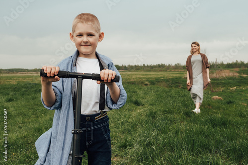 Mom with children for a walk in the field