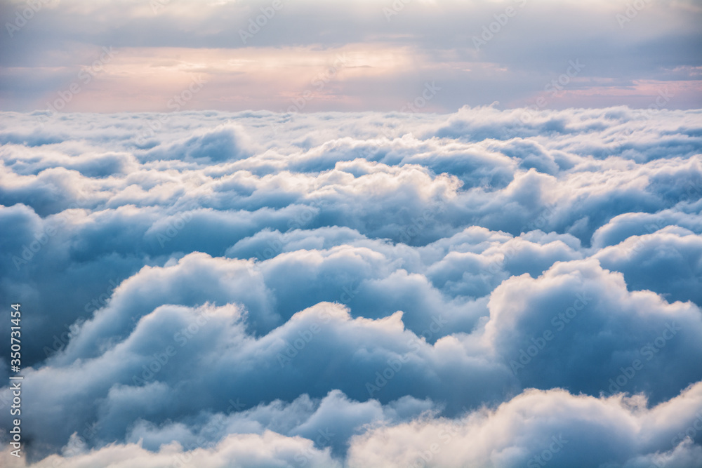 View of the clouds from above at dawn - obrazy, fototapety, plakaty 