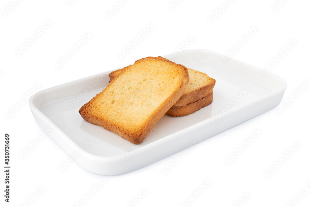 Double crispy biscottes, square cracker on white plate, on white background (Tr- etimek) Double crispy biscottes, square cracker on white plate, on white background (Tr- etimek)