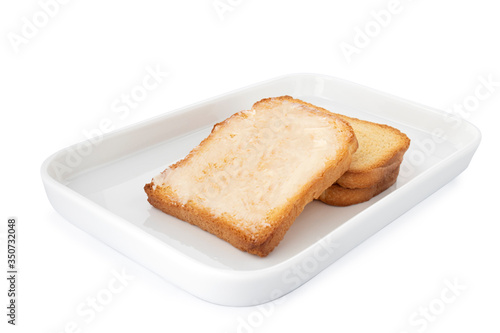 Double crispy biscotti with butter, square cracker on white plate, on white background (Tr- tereyagli etimek)