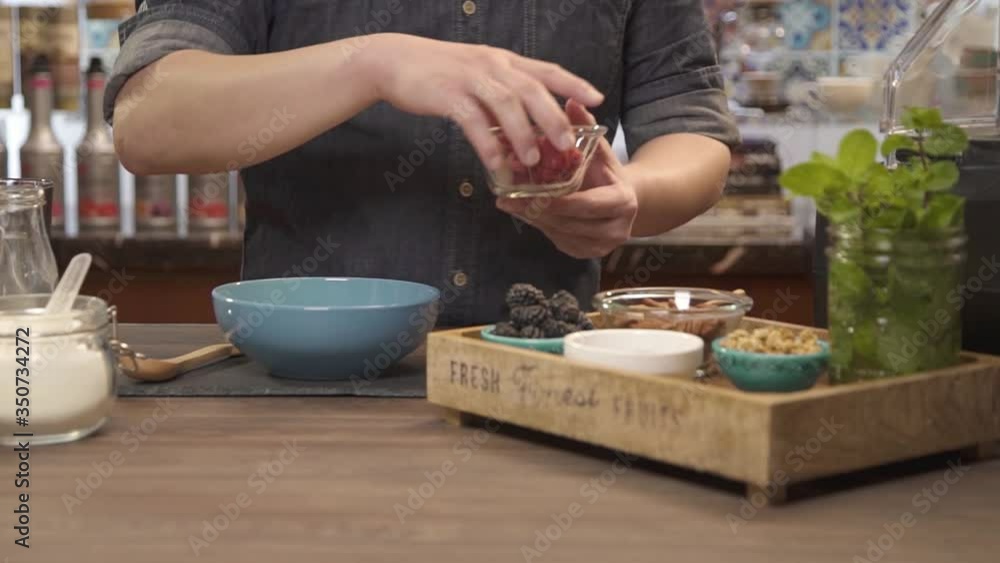 picking up a bowl with berries up - static.mp4 picking up a bowl with berries up - static.mp4