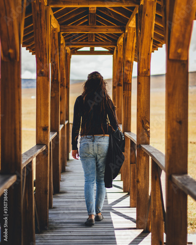 young girl walking on the bridge