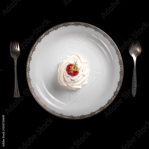 serving dishes  strawberries with tail on the whipped cream 