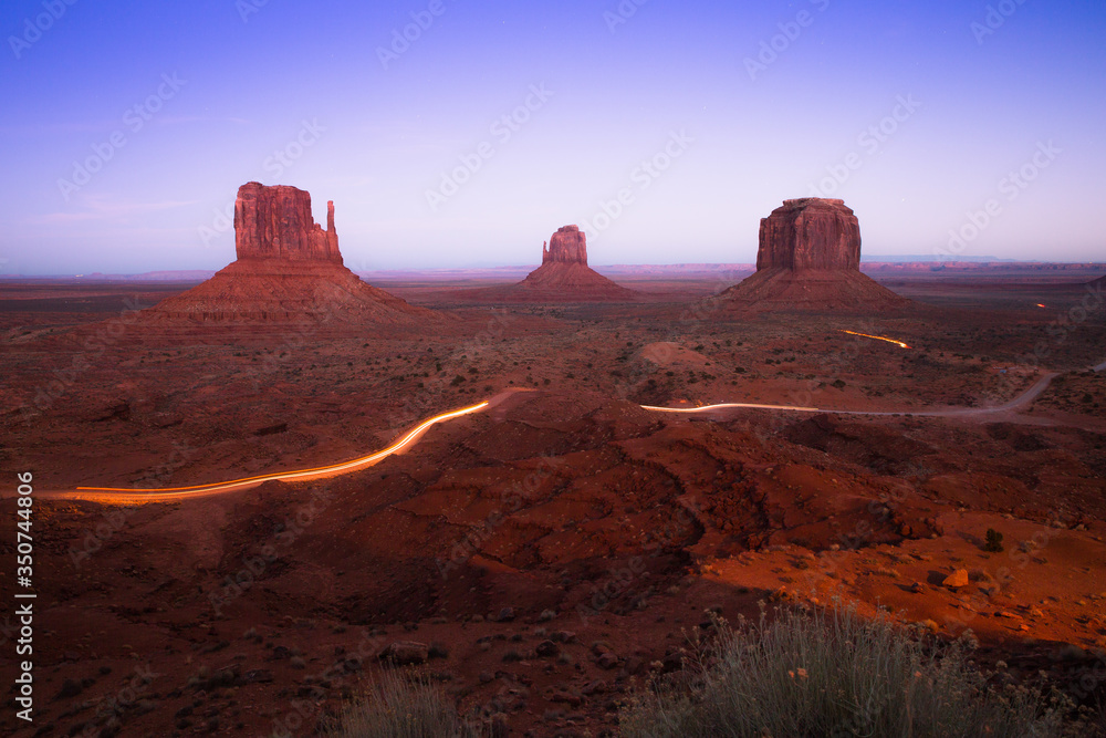 Incredible sunset at Monument Valley , a red-sand desert region on the Arizona-Utah border, Utah. Twlight shot of the buttes at John Ford’s Point.