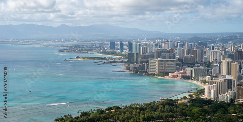 Vista on coastal city with azure waters, shot at Diamond Head Lookout near Honolulu, Hawaii, USA