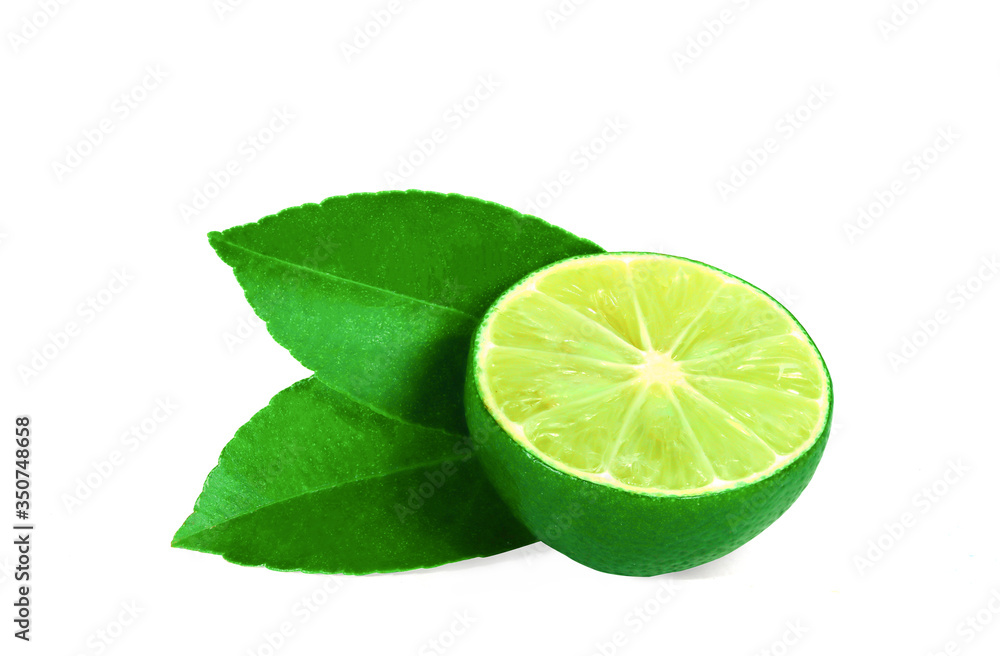 Slice half a fresh lime with sharp green leaves. Sour fruit, with shadows isolated on a white background Slice half a fresh lime with sharp green leaves. Sour fruit, with shadows isolated on a white background
