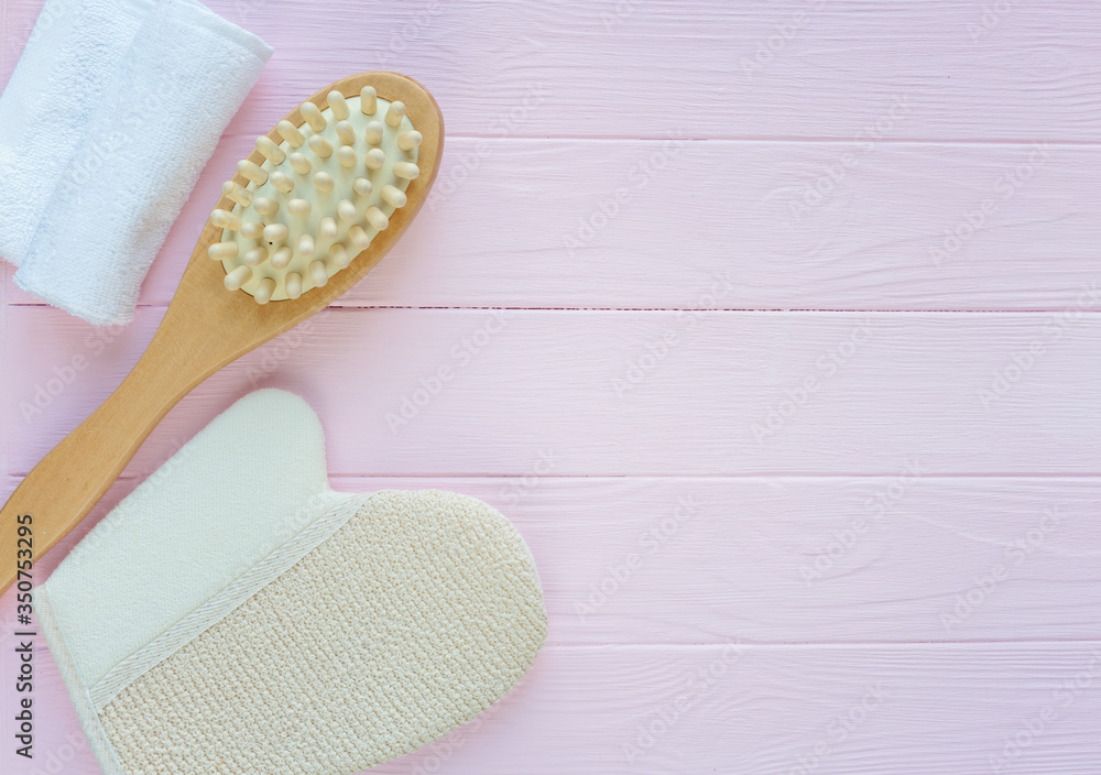 Close up wooden massage brushes for skin and body care on pink background. Beauty, spa and bath concept. Flat lay, top view Close up wooden massage brushes for skin and body care on pink background. Beauty, spa and bath concept. Flat lay, top view