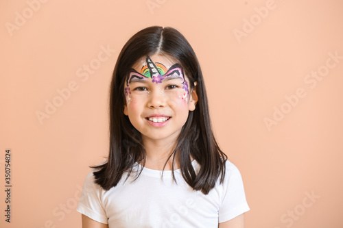Funny Asian girl with face ...
