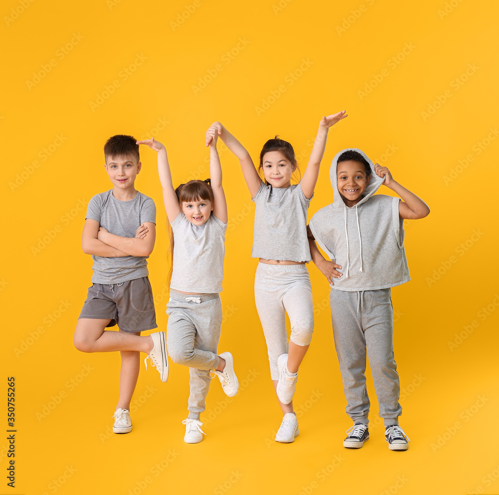 Obraz premium Cute little dancers on color background