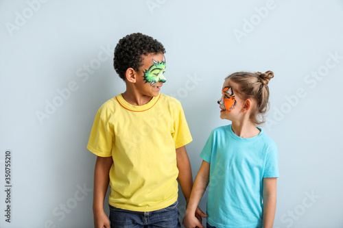 Funny children with face pa...