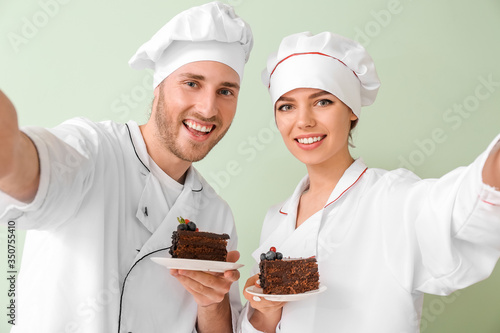 Young confectioners with ta...