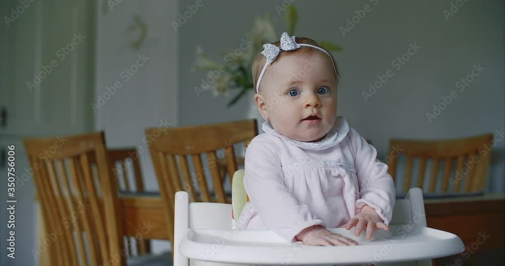 baby girl on high chair waiting on lunch baby girl on high chair waiting on lunch