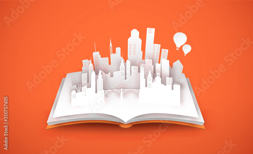 Open book with 3d papercut tower city concept