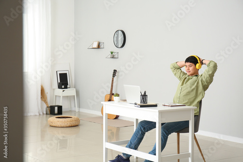 Young Asian man relaxing af...