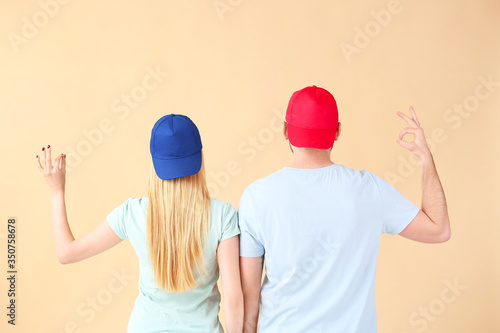 Young couple in stylish cap...
