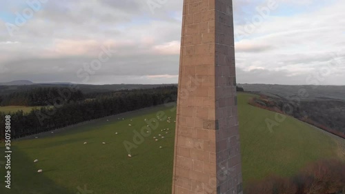 Rising close up aerial drone shot revealing Knockagh Monument in Country Antrim, NI photo