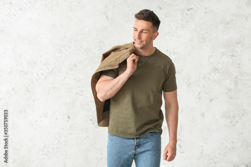 Man in stylish t-shirt on l...