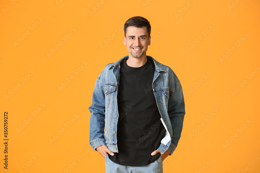 Fototapeta premium Man in stylish t-shirt on color background