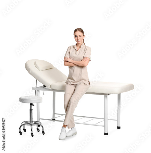 Portrait of female massage therapist on white background