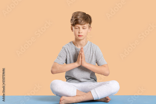 Cute little boy practicing ...