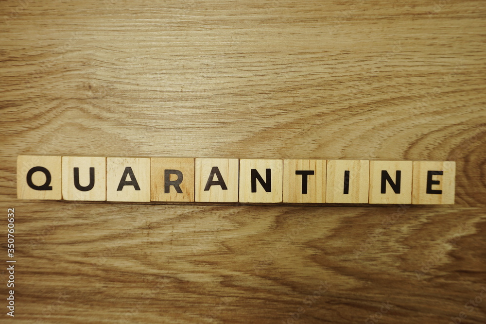 Quarantine alphabet letter on wooden background Quarantine alphabet letter on wooden background