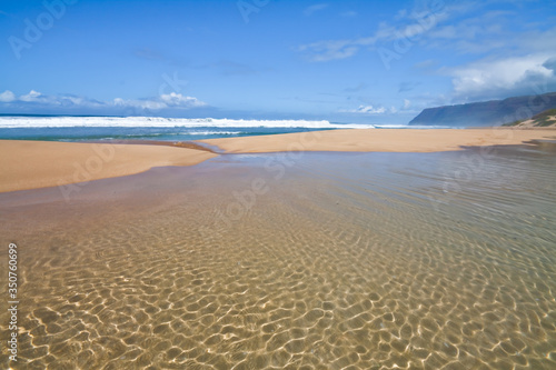 Queen's Pond Draining Into The Pacific Ocean With The Na Pali Cliffs in The Distance, Polihale Beach, Polihale Beach State Park, Kauai, Hawaii, USA