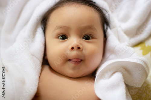Cute little baby boy on towel after bath