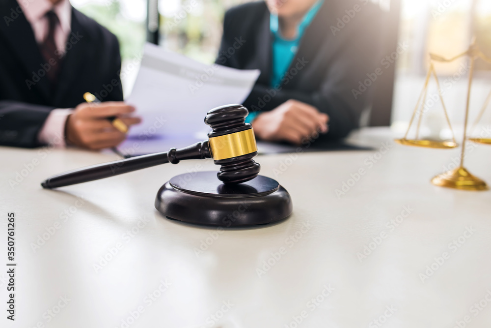 Team of lawyers man working together on legal matters in the office. Team of lawyers man working together on legal matters in the office.