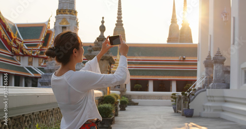 Photography Woman go travel and take photo on cellphone at bangkok